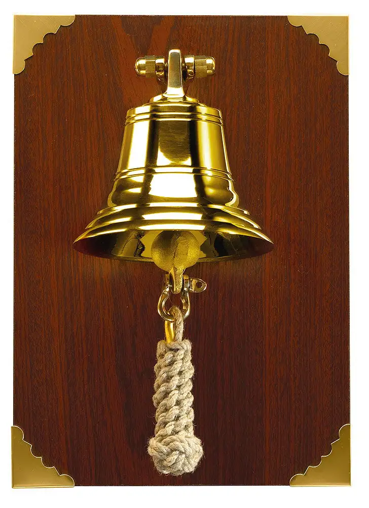 Campana su tavola di legno
